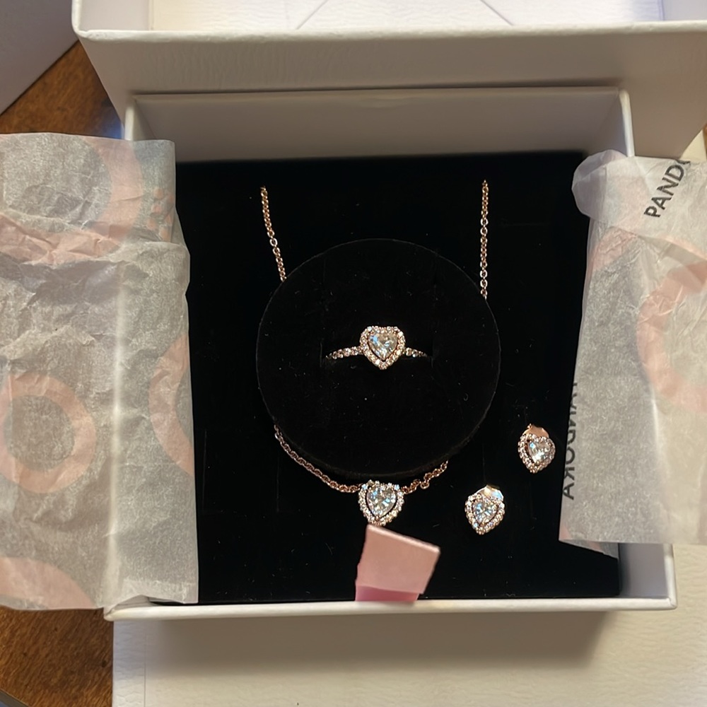 Rose gold heart shaped pandora jewelry. Includes necklace, earrings, & ring,
